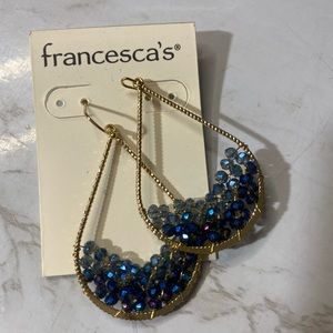 Francesca’s blue topaz crystal tear drop shaped earrings.
